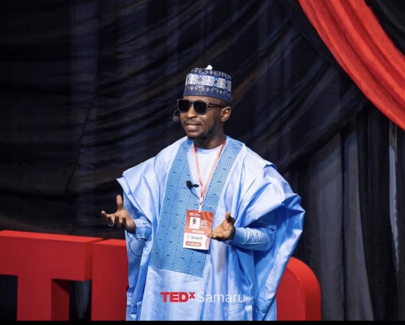 Sir YB speaking on stage at TEDxSamaru